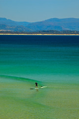 Fototapeta na wymiar Paddle Surfing Byron Bay