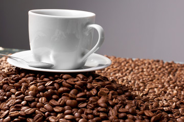 Cup with coffee, costing on coffee grain