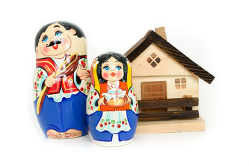 Russian nested dolls and wooden house
