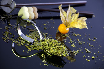 Obraz na płótnie Canvas Dried green tea leaves, close-up