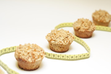 Crunchy carrot muffins with measurement tape