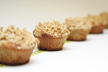 Crunchy carrot muffins on measuring tape