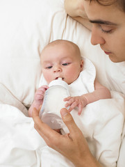 Father Feeding Baby