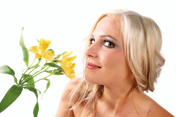 Pretty woman with yellow flower