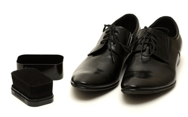 Classic black men's shoes with sponge isolated on white