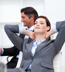 Businesswoman sleeping with feet on desk