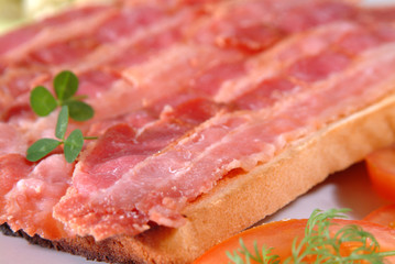 grilled organic bacon on toast and tomato