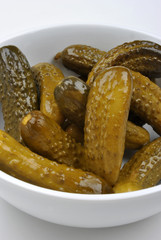 some organic sour gherkin and a white background