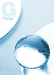 Globe made of glass in blue ambient light.