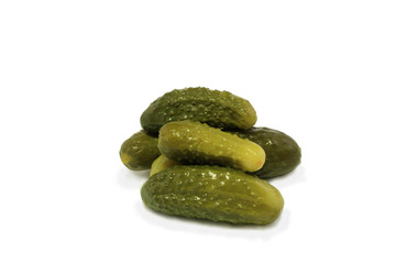 salty pickled cucumbers are delicious green on a white plate
