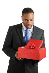 African american business man holding a christmas gift box