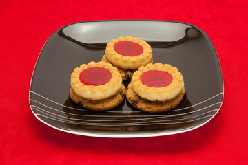 plate of cookies on red background