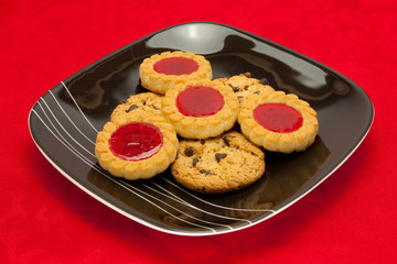 plate of cookies on red background