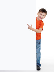 little boy pointing on the blank poster