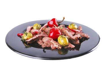beef meat served on black
