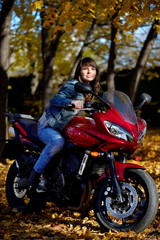 Fototapeta na wymiar The girl and a motorcycle