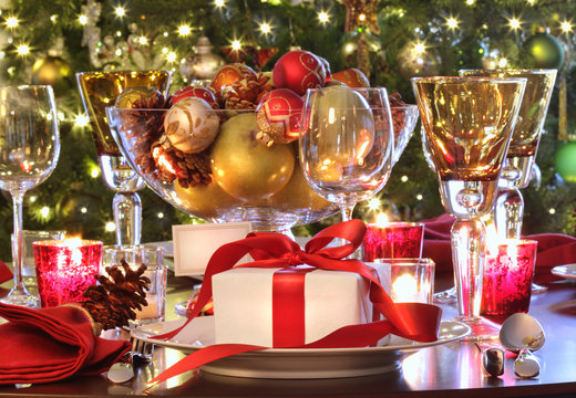 Holiday table setting with red ribbon gift