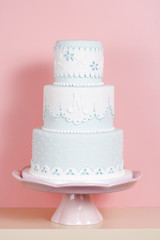 Two-tiered Cake Against Pink Background