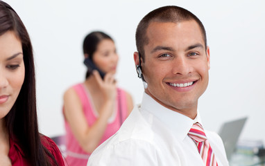 Smiling businessman with headset on