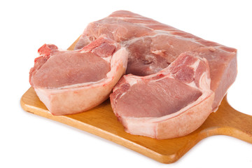 Fresh pork meat on wooden board