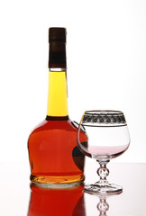 Bottle elite cognacand and empty goblet