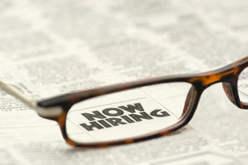 Now Hiring classified ad framed in glasses