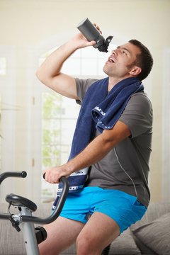 Man drinking water during exercise
