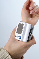 adult taking blood pressure