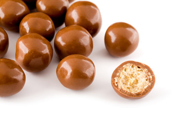 Chocolate balls and a half with crisp filling isolated on white