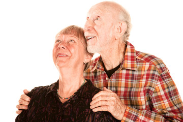 Happy seniuor couple looking up