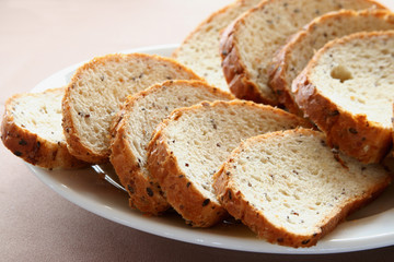 Appetizing slices of a white loaf lie on a plate