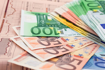 euro notes on a financial newspaper