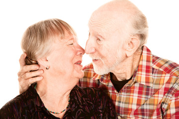 Smiling senior couple touching noses
