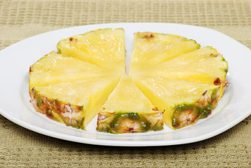 cut pineapple on a plate