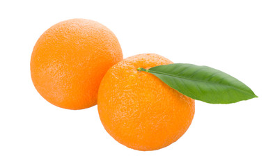 two oranges with leaves