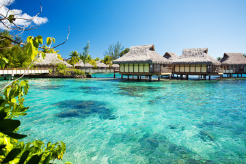 Over water bungalows with over amazing lagoon - obrazy, fototapety, plakaty