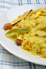 dry roasted chevda on a white plate