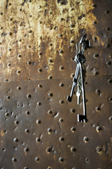 Old bunch of keys hanging from lock