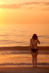 Fototapeta na wymiar Woman by beach
