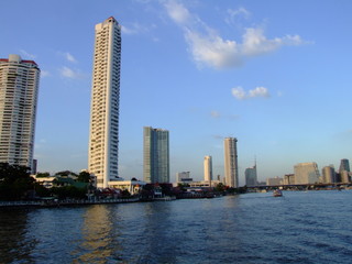 Fototapeta na wymiar Bangkok skyscrapers next to Chao Phaya river, Thailand.
