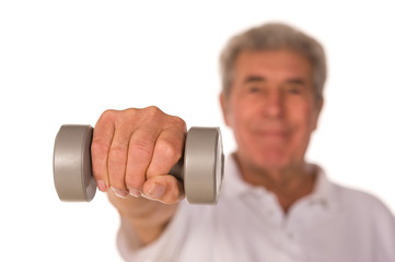 Mature older man lifting weights
