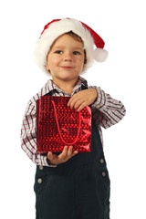 Smiling little boy with Christmas gift bag