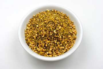 some organic lemon pepper in a white bowl