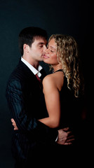 Handsome man kissing his girlfriend