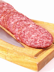 The cut sausage on a white background