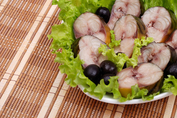 Composition from a smoked mackerel on a plate
