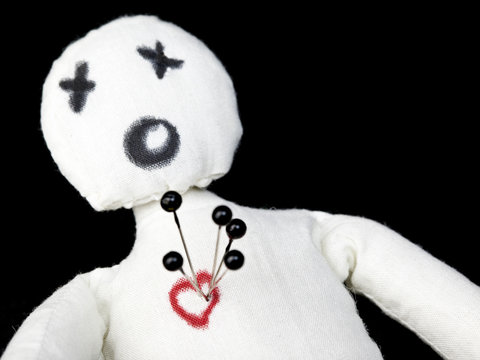 Voodoo Doll With Pins In Its Heart