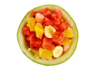 Fototapeta na wymiar Mixed fruit in watermelon shell. Close up on white background