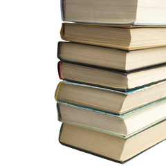 Pile of old books on white background.