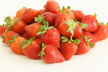 Close up of strawberries on a white background